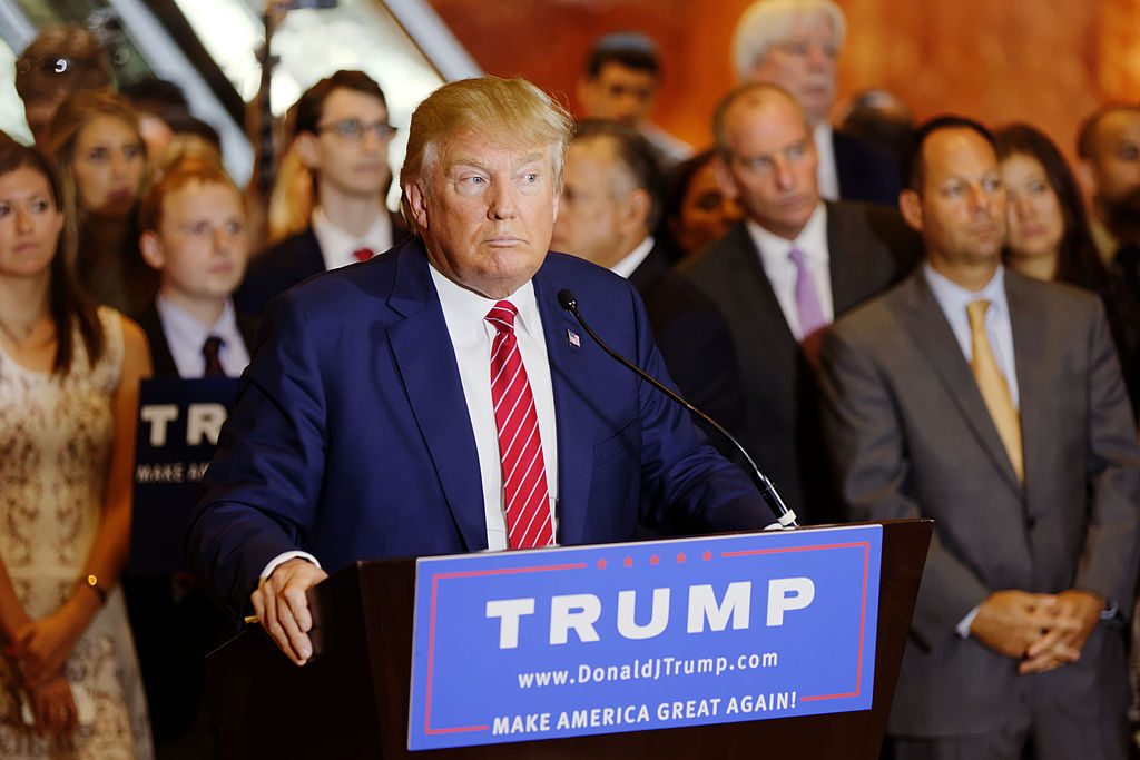 Donald Trump signing the Republican pledge to support whoever becomes the GOP nominee. "So I will be totally pledging my allegiance to the Republican Party and for the conservative principles for which it stands." (Michael Vadon/Wikimedia)